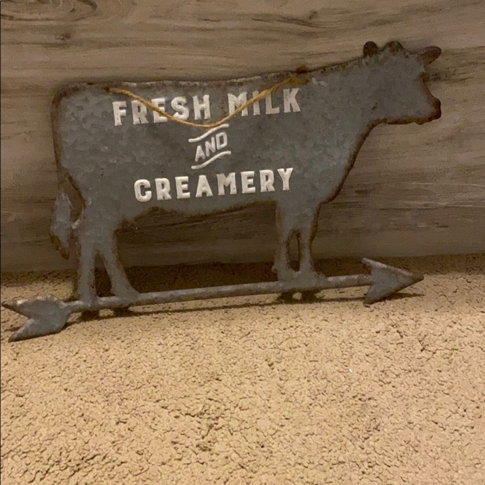 Hanging cow sign